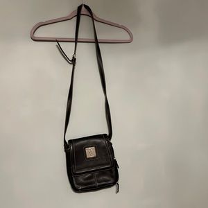 Versatile over the shoulder or messenger purse with loads of compartments!